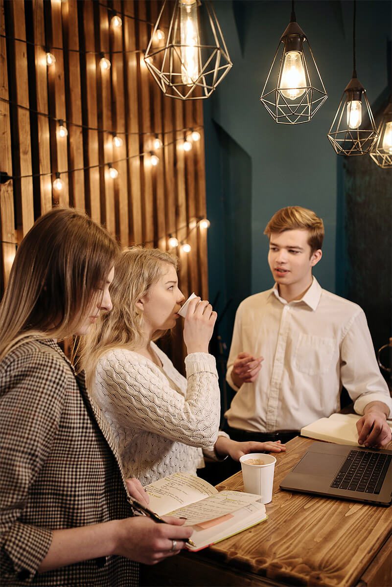 Team members drinking discussing